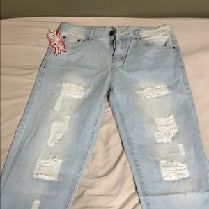 Brand new light blue ripped jeans